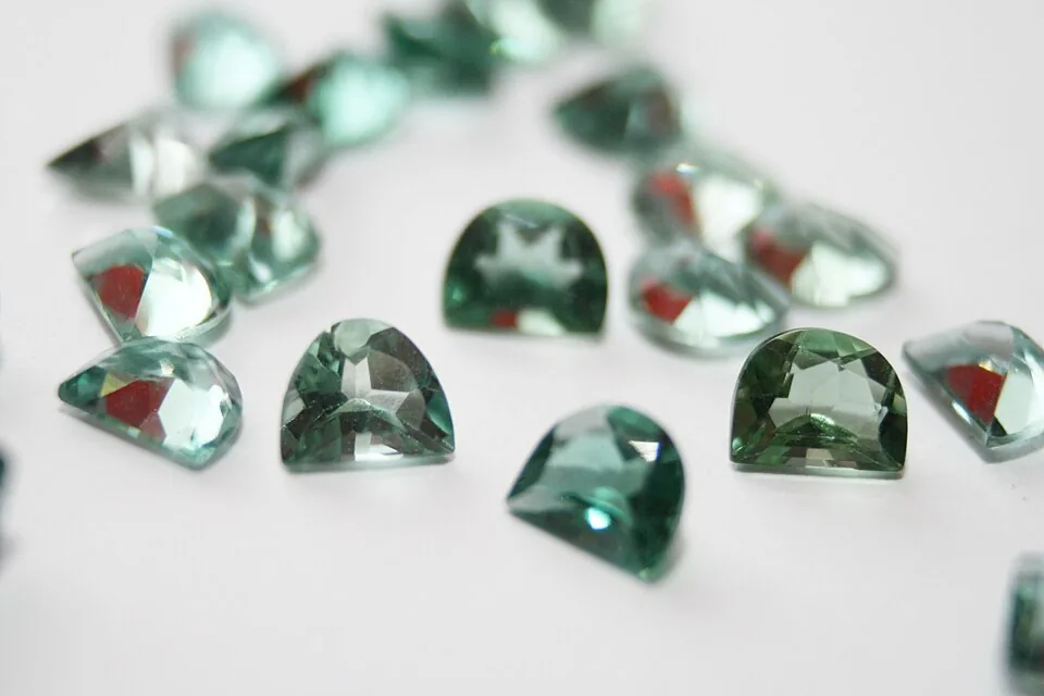 Faceted pale green prasiolite gemstones